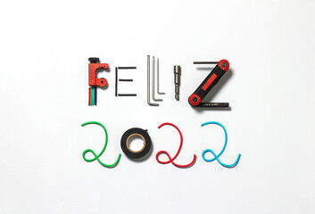 Happy 2022 with tools and electrical elements.