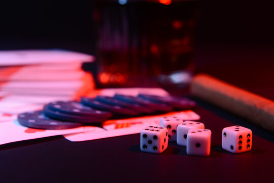 Dices for poker on dark background