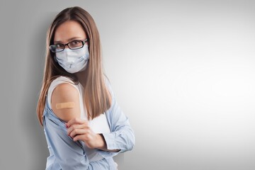 Beautiful young woman wearing mask getting a vaccine protection the coronavirus.