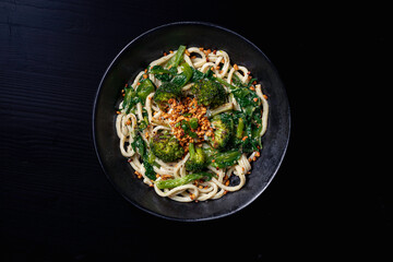Thai Asian noodle with broccoli, bok choy, peanut sauce and chopped peanut