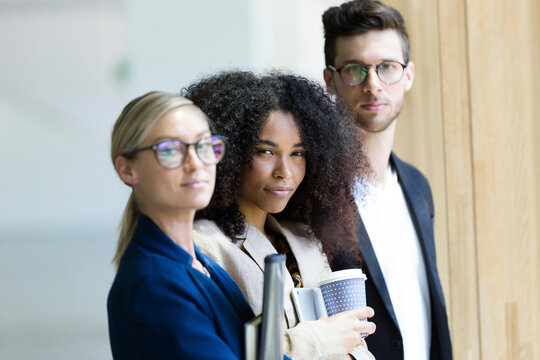 Portrait of confident young business people