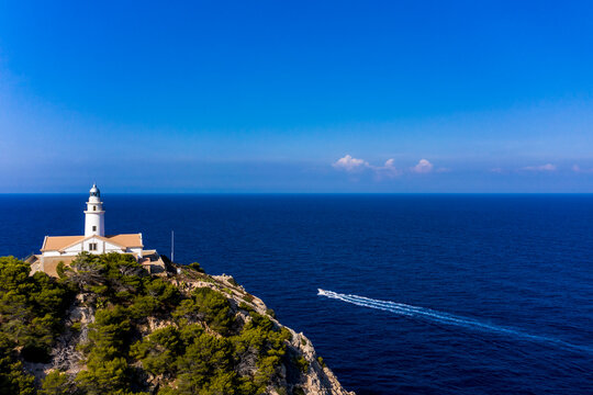 Spain, Mallorca, Cala Ratjada, Helicopter view of Far de Capdepera lighthouse in summer