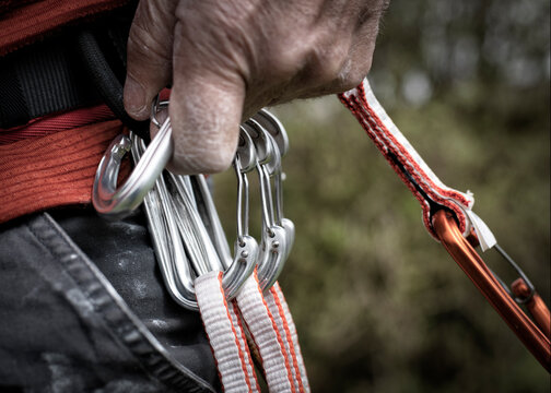 Unclipping a rock climbing karabiner