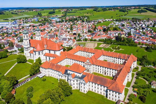 Germany, Bavaria, Ottobeuren, Helicopter view of Ottobeuren Abbey and surrounding town in summer