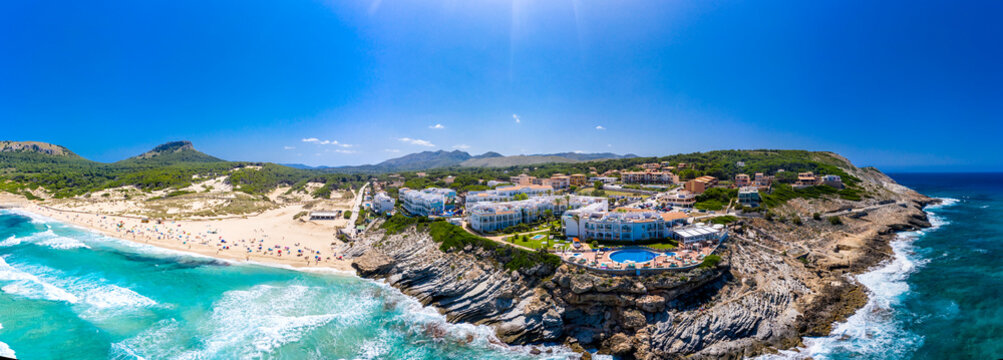 Spain, Mallorca, Cala Mesquida, Aerial panorama of Cala Agulla beach and coastal resorts in summer