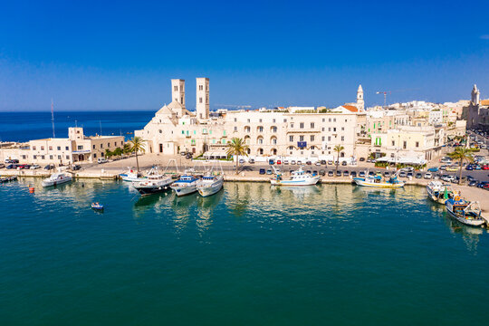 Italy, Province of Bari, Molfetta, Drone view of old town marina in summer