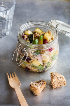 Jar of gluten free vegan salad with buckwheat, zucchini and paprika