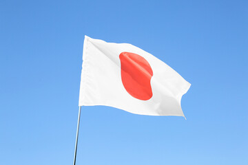 Waving flag of Japan outdoors