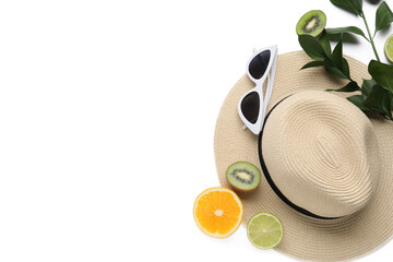 Composition with stylish hat, sunglasses and fruits on white background