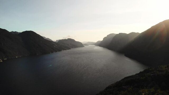 A breathtaking huge fjord in the norwegian mountains. Sunset near Preikestolen