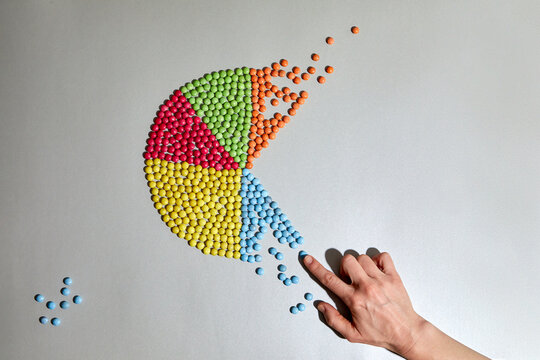 Hand and colorful pie chart