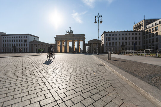 Germany, Berlin, Cobblestone square in front ofÔøΩBrandenburg Gate during COVID-19 epidemic - Powered by Adobe