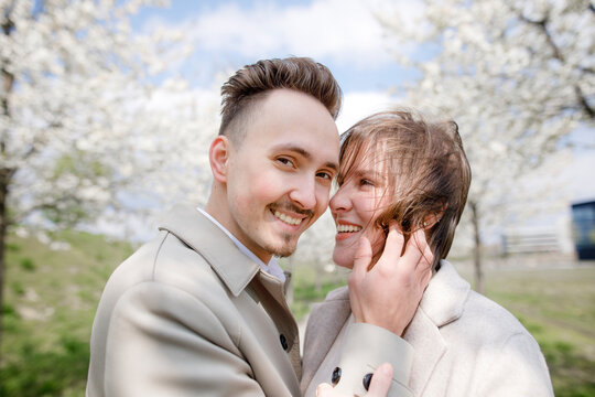 Affectionate couple strolling in a park in spring