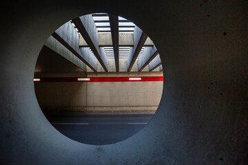 Germany, Berlin, Asphalt road at Berlin Tegel Airport seen from inside of circular tunnel