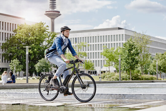 Student on his e-bike at Goethe University in Frankfurt, Germany