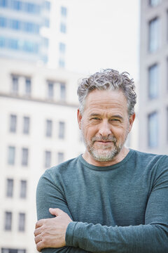 Portrait of confident mature man in the city
