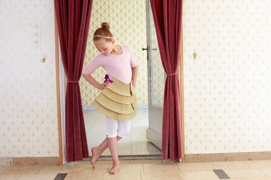Girl playing with cardboard tutu