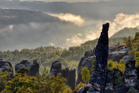 Germany, Saxony, Elbe Sandstone Mountains, rocks and rock needles of the Schrammsteine at backlight