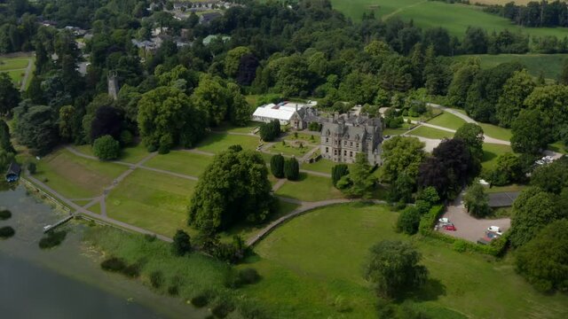 Castle Leslie, Glaslough, Monaghan, Ireland, July 2021. Drone slowly orbits while gradually pulling away from the west to the northern side.