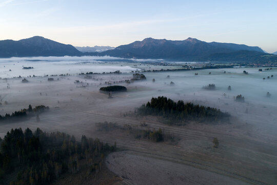 Germany, Bavaria, Drone view of Loisach-Kochelsee-Moore bogs shrouded in morning fog
