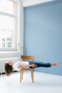 Woman hoverin on chair