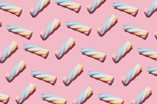 Pattern of marshmallows against pink background