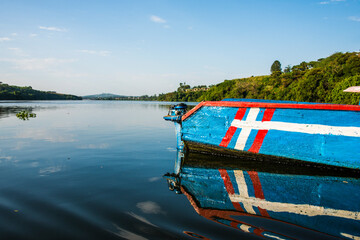 Africa, Uganda, Jinja, Colourful boat at the source of the Nile
