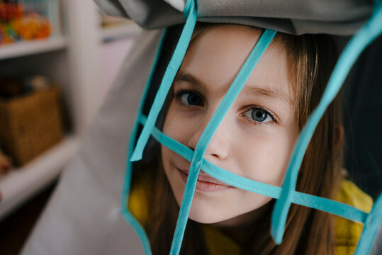 Portrait Of Girl Behind Grid