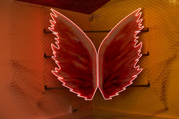 Red glowing neon wings