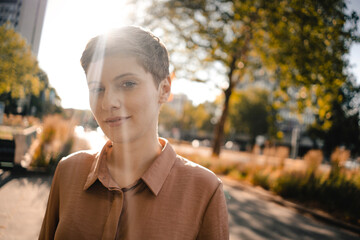 Portrait of confident woman in backlight