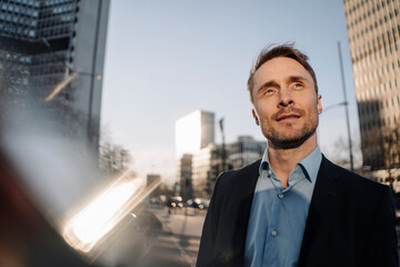 Successful businessman walking in the city