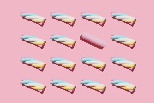 Pattern of twisted marshmallows with single one standing out