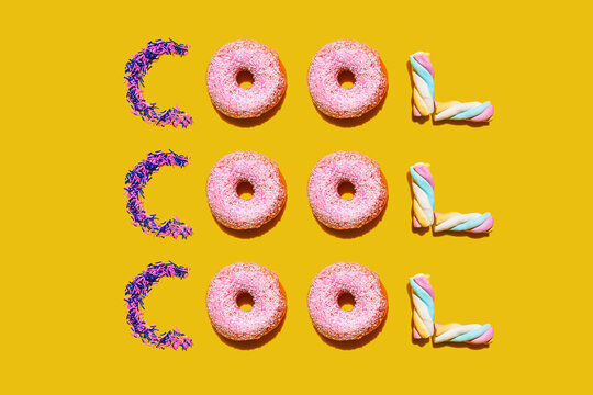 Doughnuts, marshmallows and sugar sprinkles arranged into single repeated word