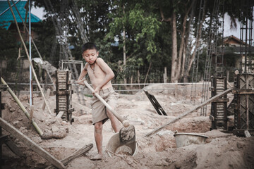 Children working at construction site for world day against child labor concept. World Day Against Child Labour concept.