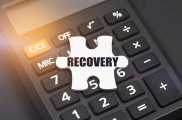 There is a white puzzle on the calculator with the inscription - RECOVERY
