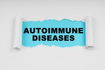 In the middle of a white sheet in space on a blue background the inscription - Autoimmune Diseases