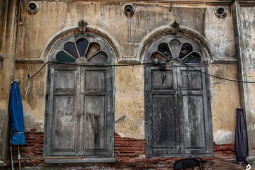 Bangkok, Thailand - Jan 09, 2019 : Wood vintage window on the old wall, Western Architecture style,...
