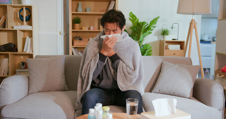 man coughs at home