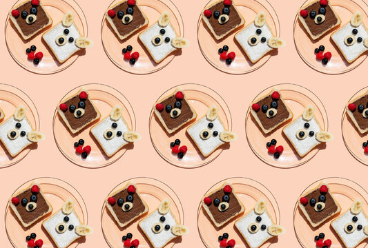 Pattern of plates with toasts decorated with bear faces made of fruits