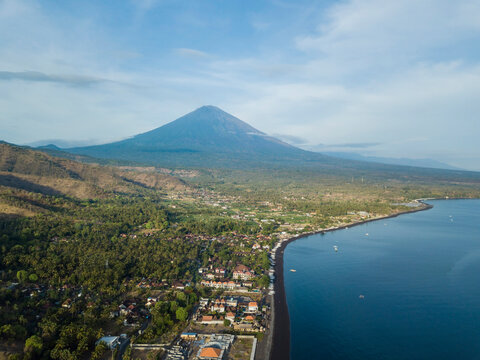 Indonesia, Bali, Amed, Aerial view of Amed beach and volcano Agung
