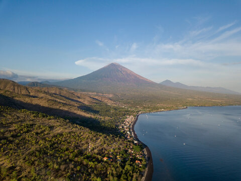 Indonesia, Bali, Amed, Aerial view of Jemeluk beach and volcano Agung