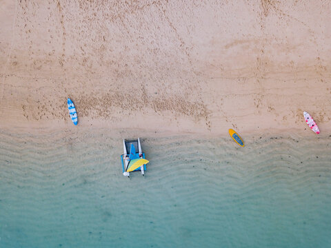 Indonesia, Bali, Nusa Dua beach, Sailboat, kayak and sup boards at the beach