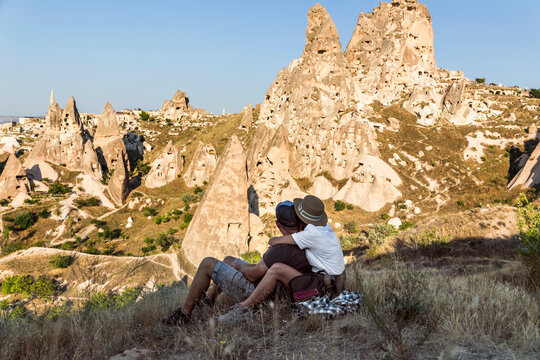 Couple looking to Uchisar castle, Cappadocia, Turkey