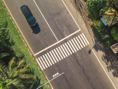 Indonesia, Bali, Sanur, Aerial view of car at zebra crossing on the road