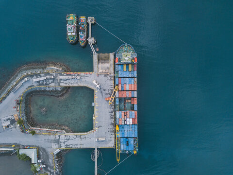 Indonesia, Sumbawa, Maluk, Aerial view of harbor, container ship from above