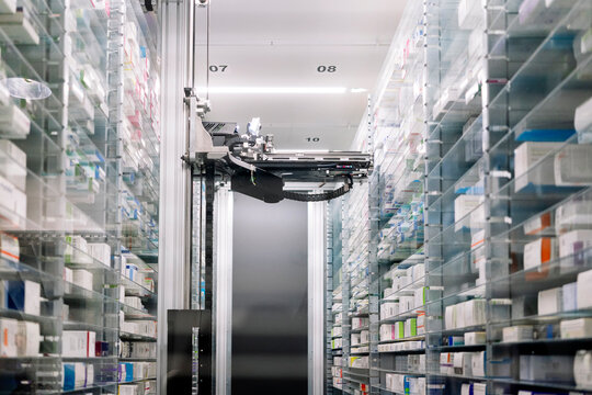 Robotic pharmacy amidst shelves in hospital