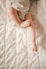 Obraz na płótnie Canvas Soft focus close-up of newborn baby feet on a white blanket.