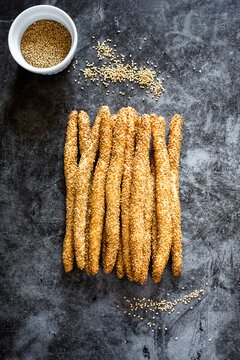 Studio shot of Italian grissini breadsticks with sesame seeds
