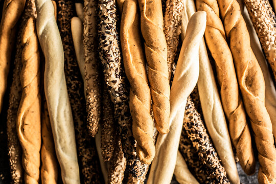 Heap of four different kinds of Italian grissini breadsticks