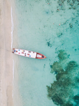 Drone shot of boat moored at shore in Gili-Air Island, Bali, Indonesia